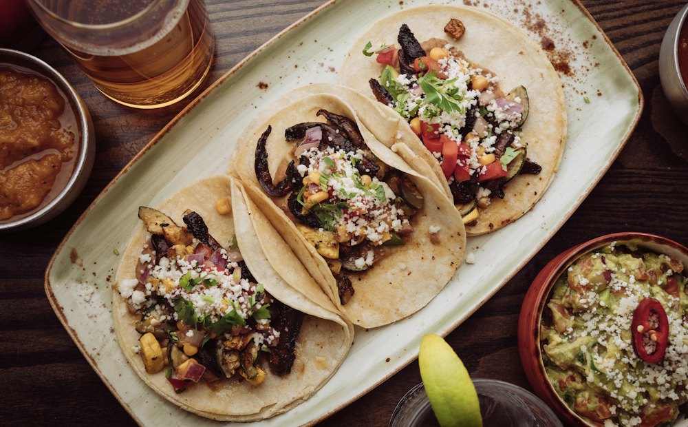 Stock photo of three tacos on a plate
